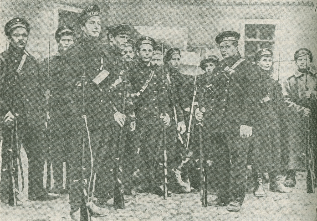 A photograph of sailors standing with their rifles