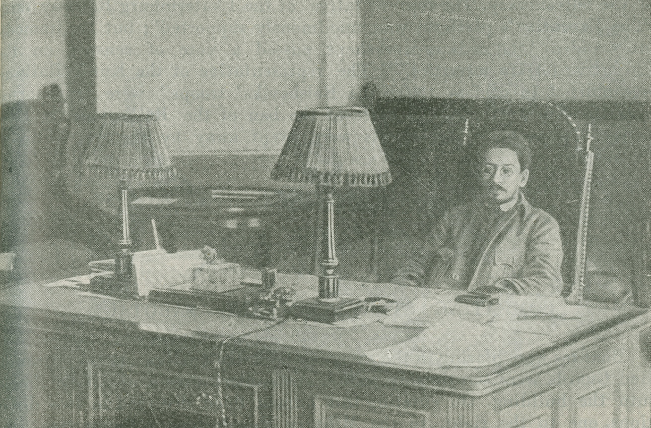 Photograph of J. M. Sverdlov seated behind a large desk